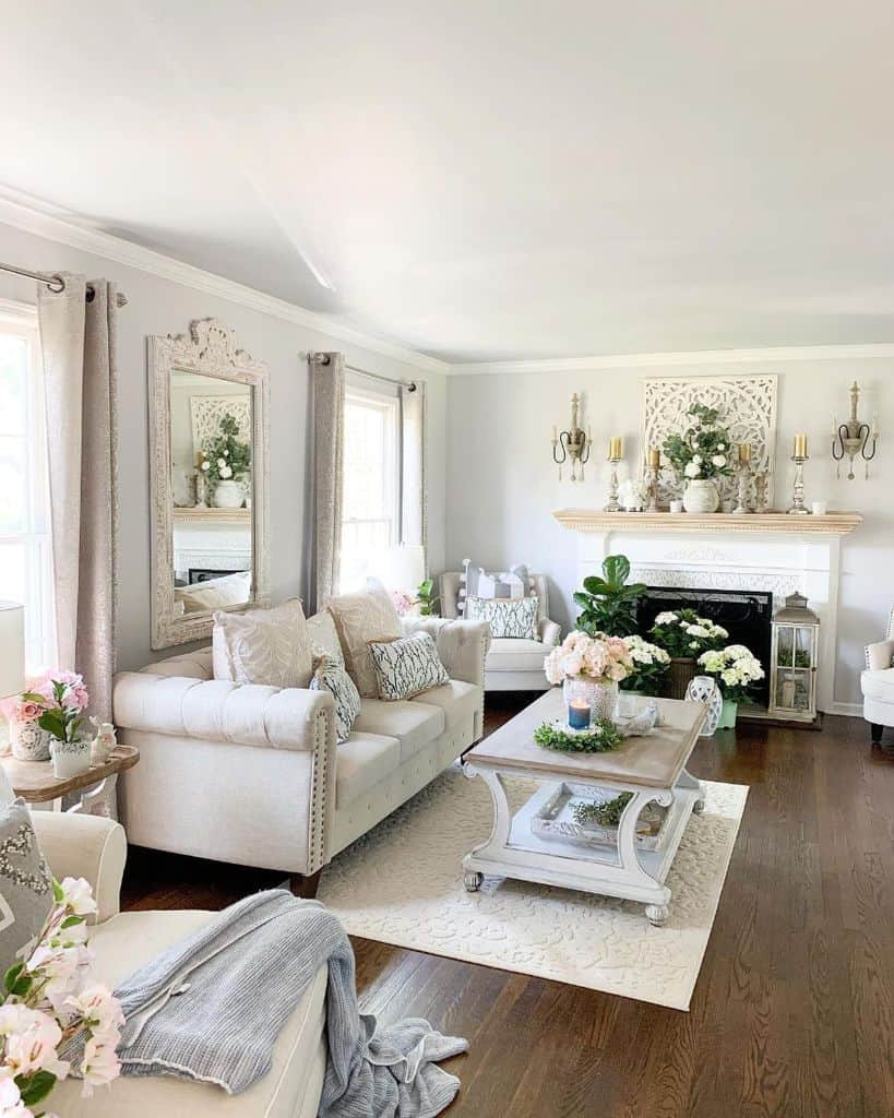 white modern farmhouse living room wood floor fireplace white sofa wood table with flowers wall mirror