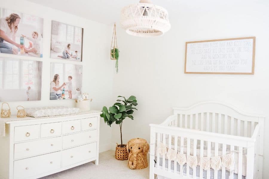 white nursery crib dresser canvas wall prints plant in wicker basket