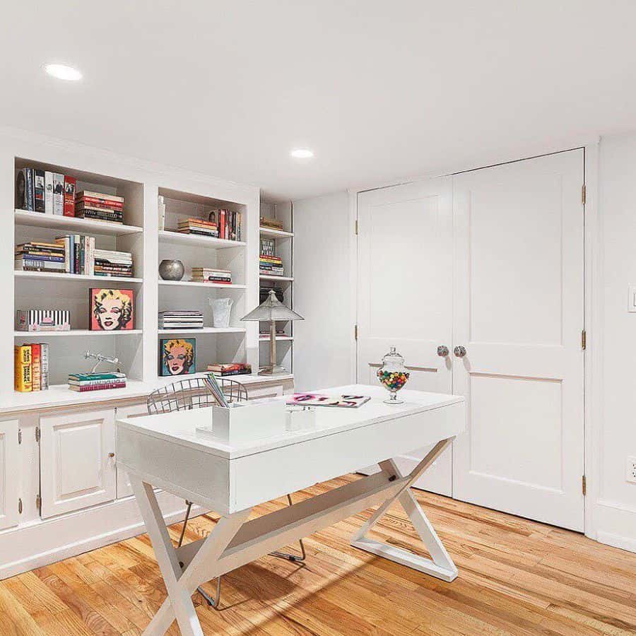 home office white desk built-in shelves and cabinets