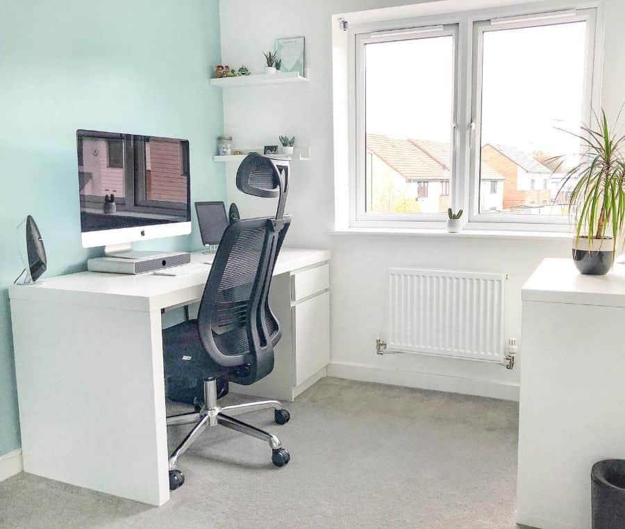 small home office blue accent wall white desk black office chair