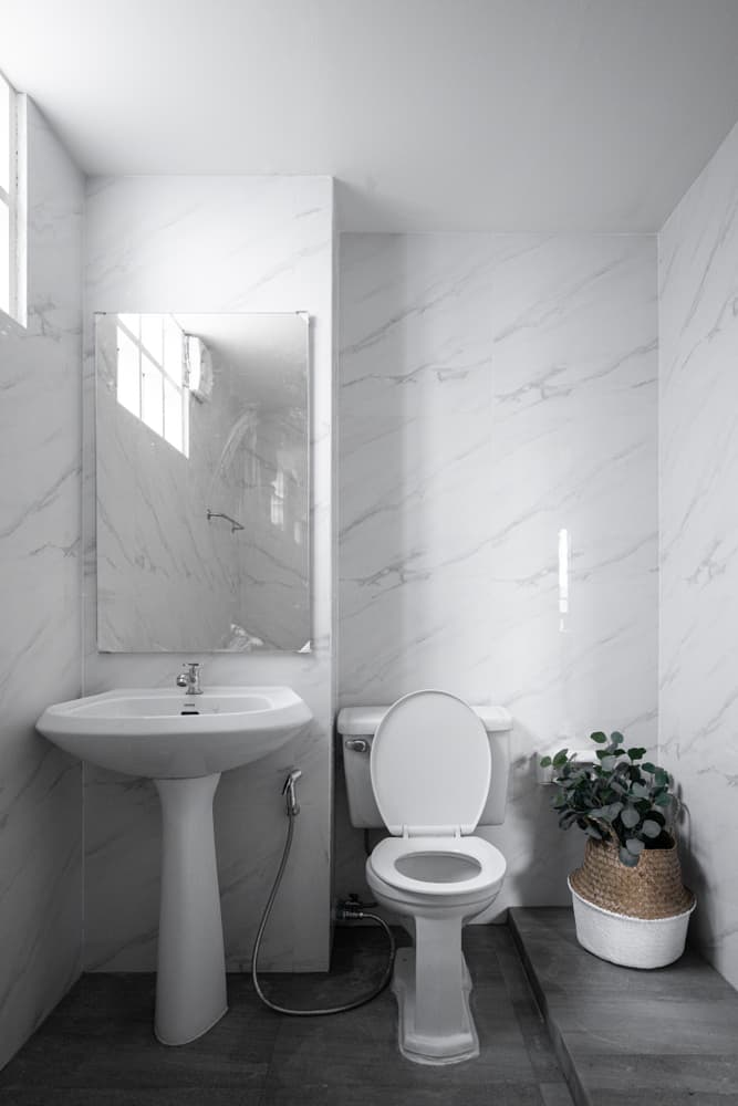 white marble powder room 