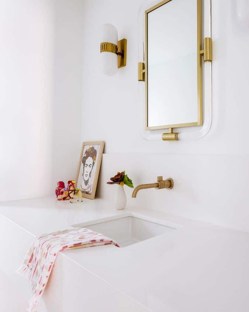 modern white bathroom with gold accents 
