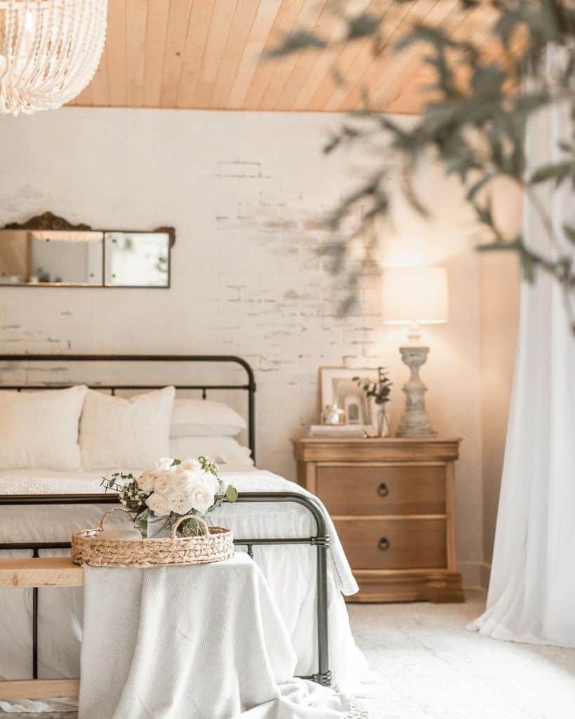 white rustic bedroom with cast iron bed frame 