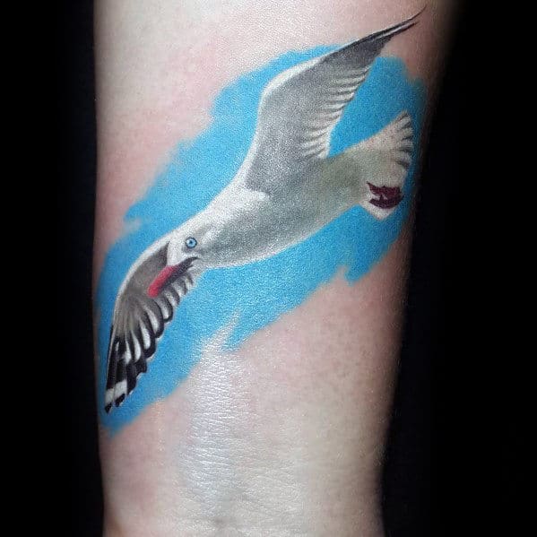 White Seagull Flying In Blue Sky Background Mens Small Wrist Tattoos