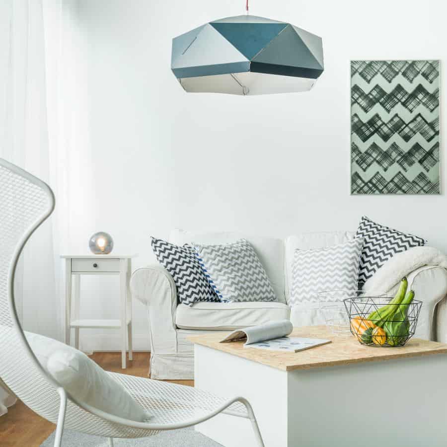 small modern living room with white sofa and abstract chair