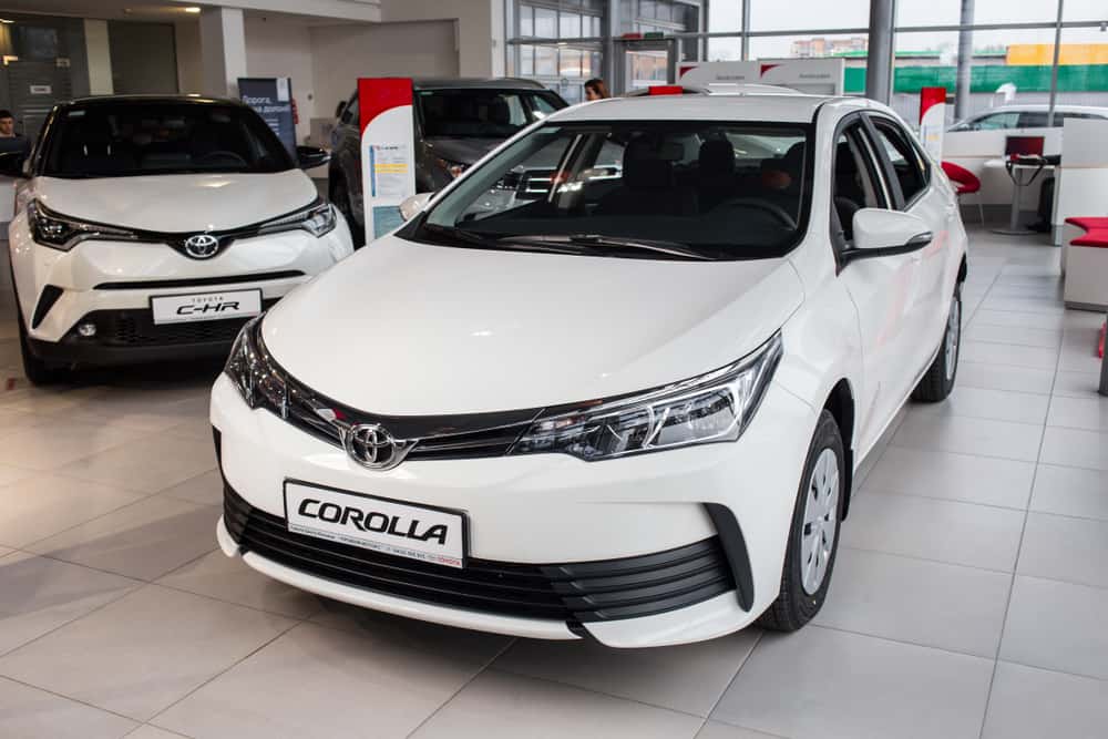 white toyota corolla front view in vinnitsa, ukraine showroom