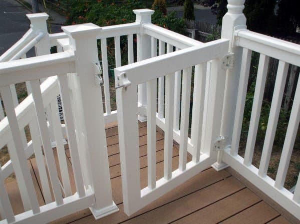 White wooden gate on a deck, seamlessly blending into the garden view