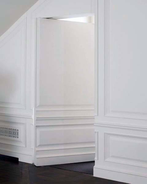 white wall panel hidden door edging