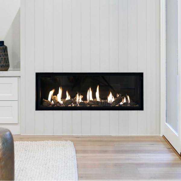 Modern gas fireplace set into a white wood-paneled wall, featuring natural log-style flames for a cozy look.