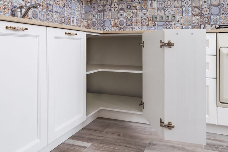 white wooden corner kitchen cabinet