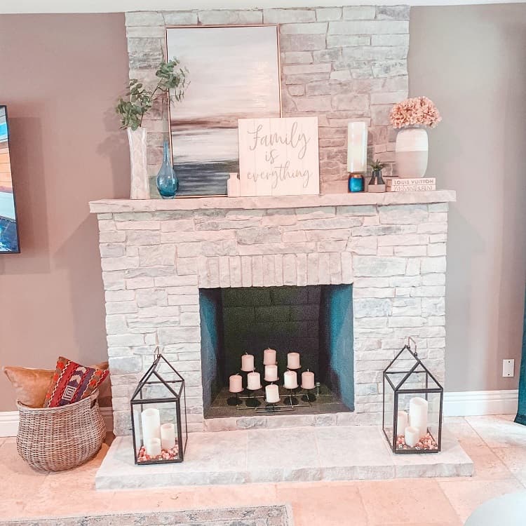 whitewashed stone fireplace mantel