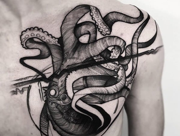 Black ink octopus tattoo with elaborate details covering the left side of a person's chest