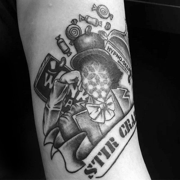 Black and white Willy Wonka tattoo with a head made of a hypnotic swirl, Wonka Bar, candies, and a banner reading STIR CRAZY.