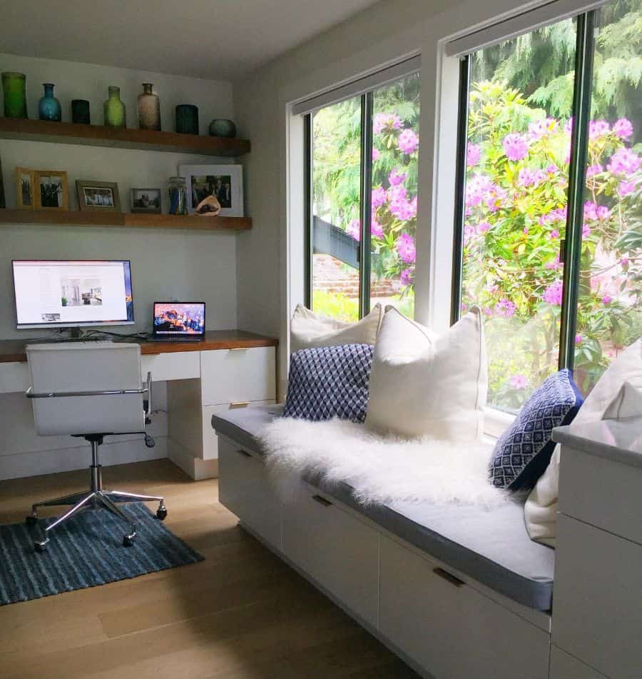 white built-in window seat with underneath storage desk and office chair
