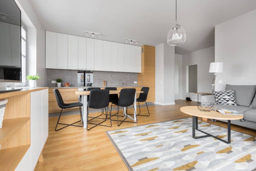 white cabinet and natural wood open plan kitchen and living room