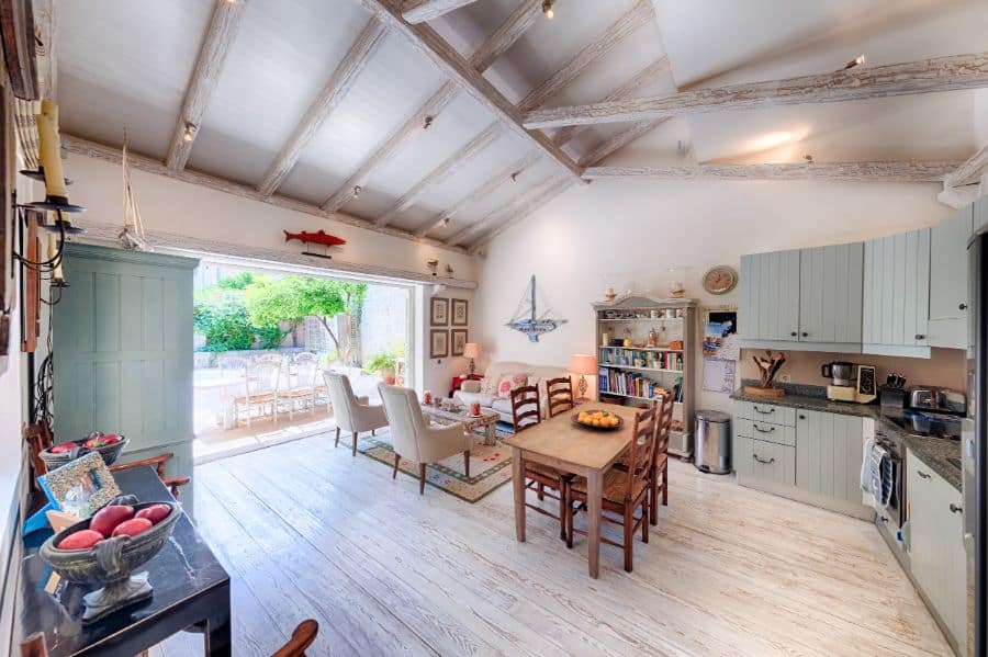 vaulted ceiling kitchen with green cabinets