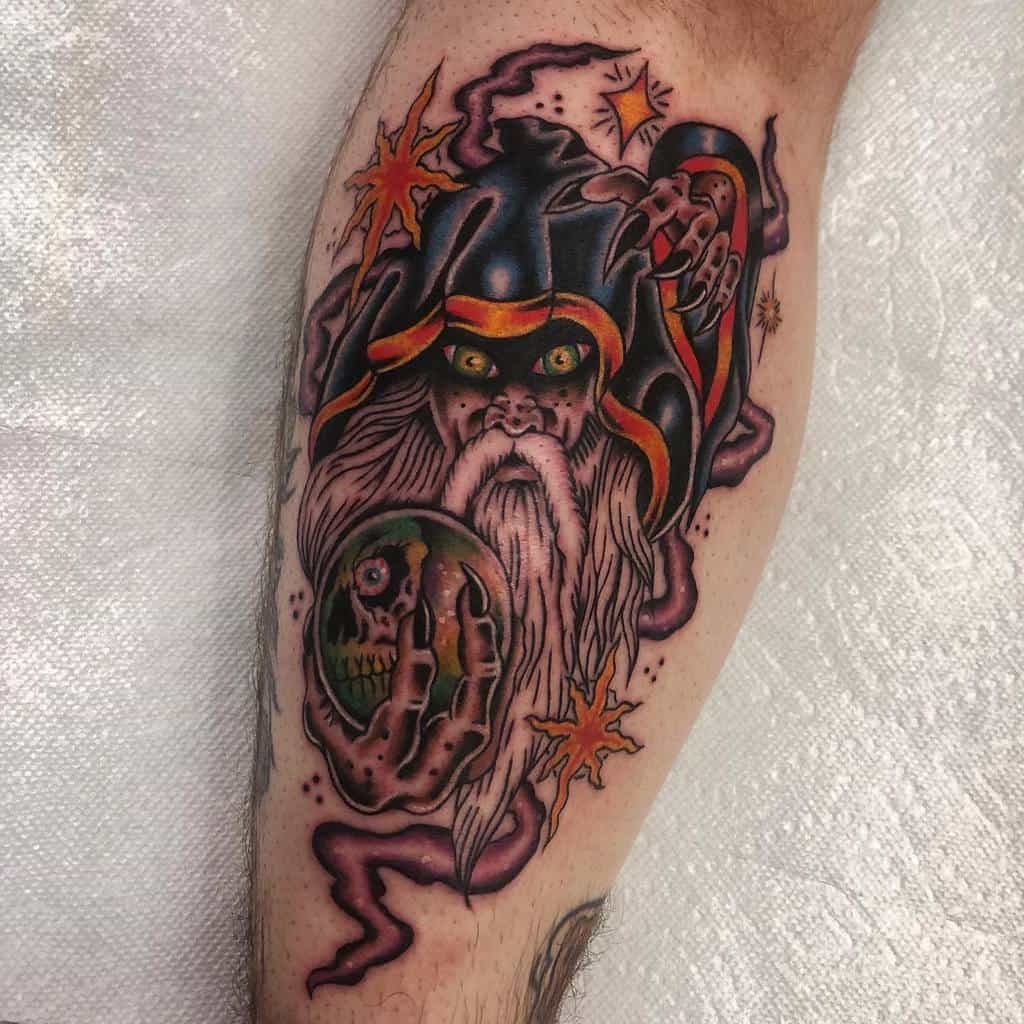 Dark fantasy Dungeons & Dragons tattoo of a sinister wizard with glowing eyes, a mystical orb, and swirling magical energy