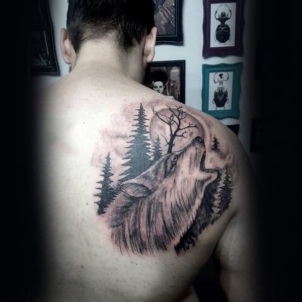 Wolf Howling At Moon With Pine Tree Mens Upper Back Tattoo