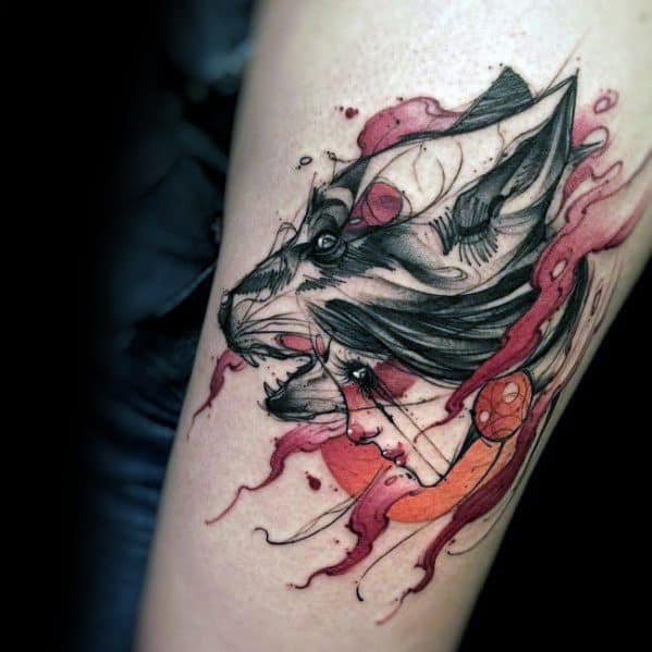 Abstract wolf tattoo with anatomical elements, red and black sketch-style lines, and dynamic watercolor splashes for a fierce, surreal design.