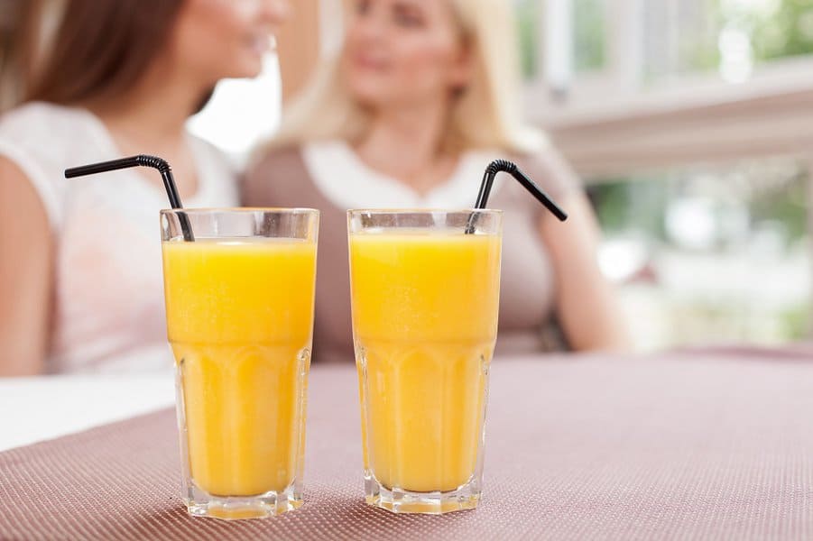 women are talking in cafeteria