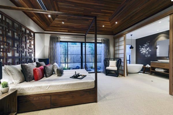 Modern Japanese bedroom with wood ceiling, sliding doors, and a connected spa-like bathroom.