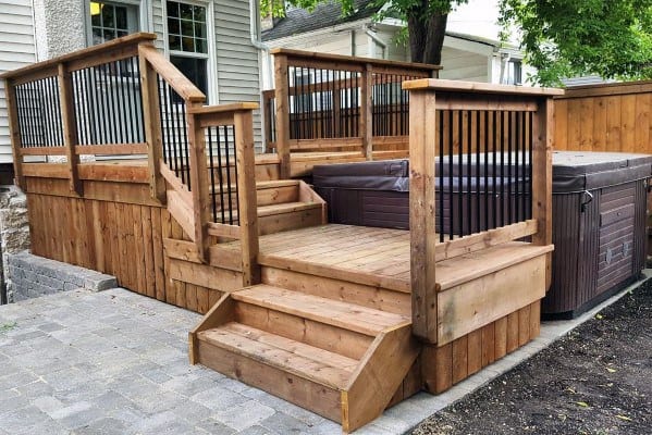 multilevel wood deck hot tub metal and wood railing
