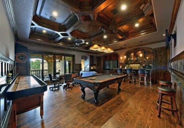 Luxurious game room with pool table, wood floor, bar, and decorative ceiling