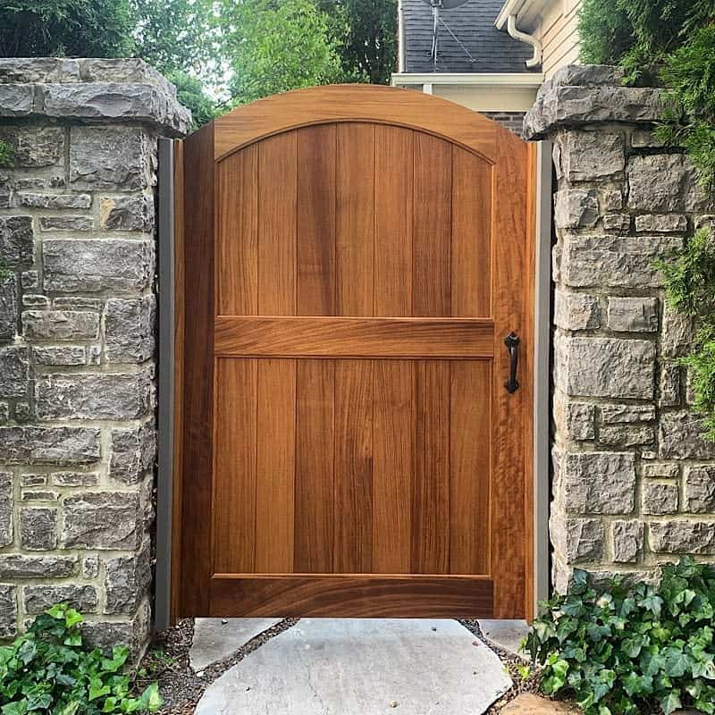small wood garden gate stone walls