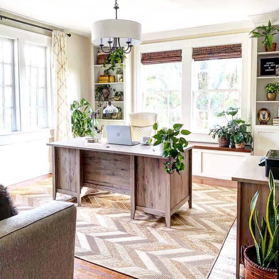 country style home office wood desk lots of plants sofa 