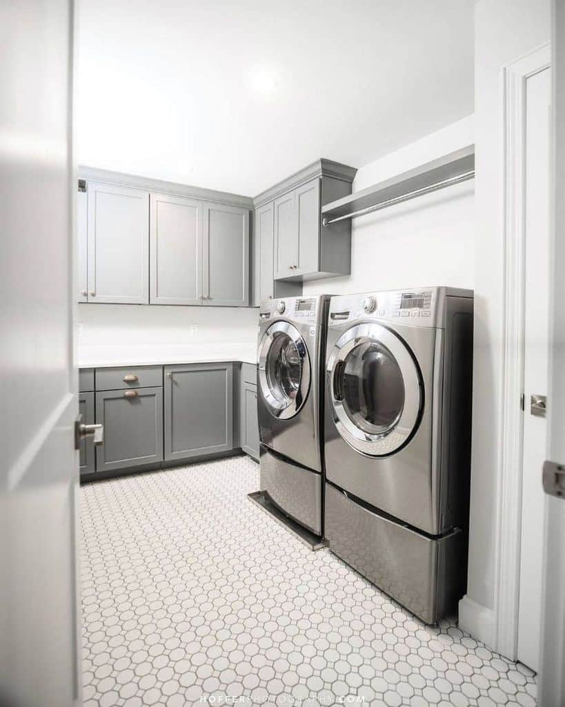 large laundry gray cabinets wash and dryer