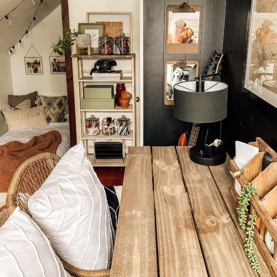 attic office living room wood desk small wooden storage unit guitar framed photos