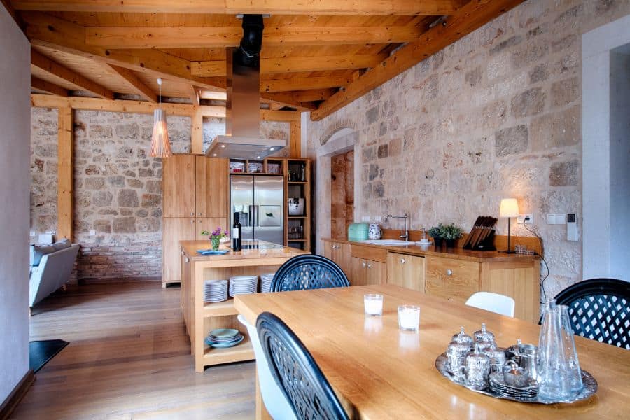 brick wall kitchen with wood cabinets