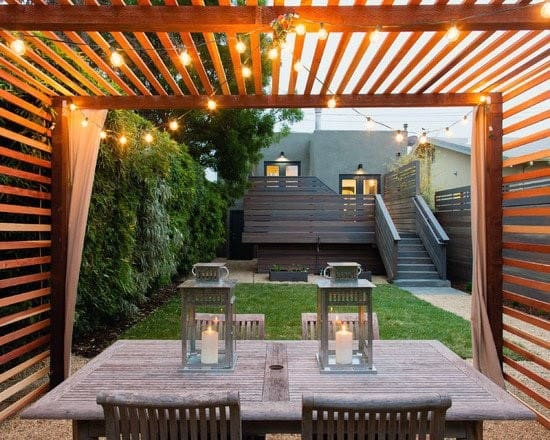 wood pergola with string lights