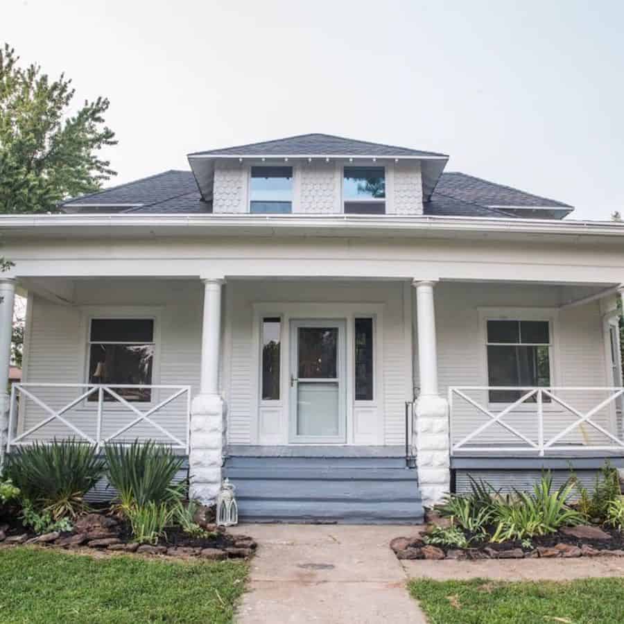 white country home with fence and railing 