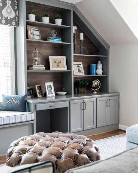 Grey bookcase with workdesk in the middle