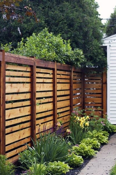 wooden fence with varied panel sizes