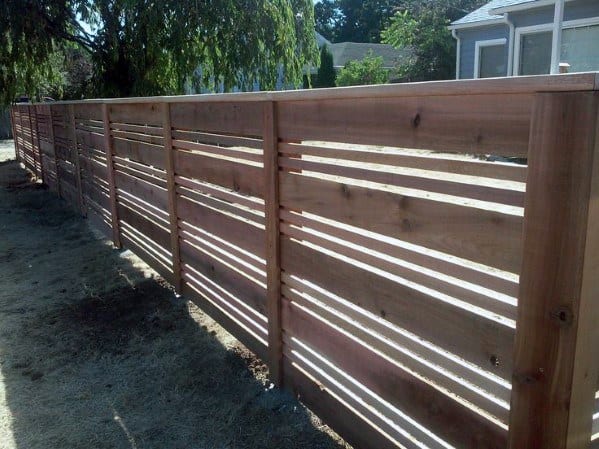 wooden fence with varied panel sizes