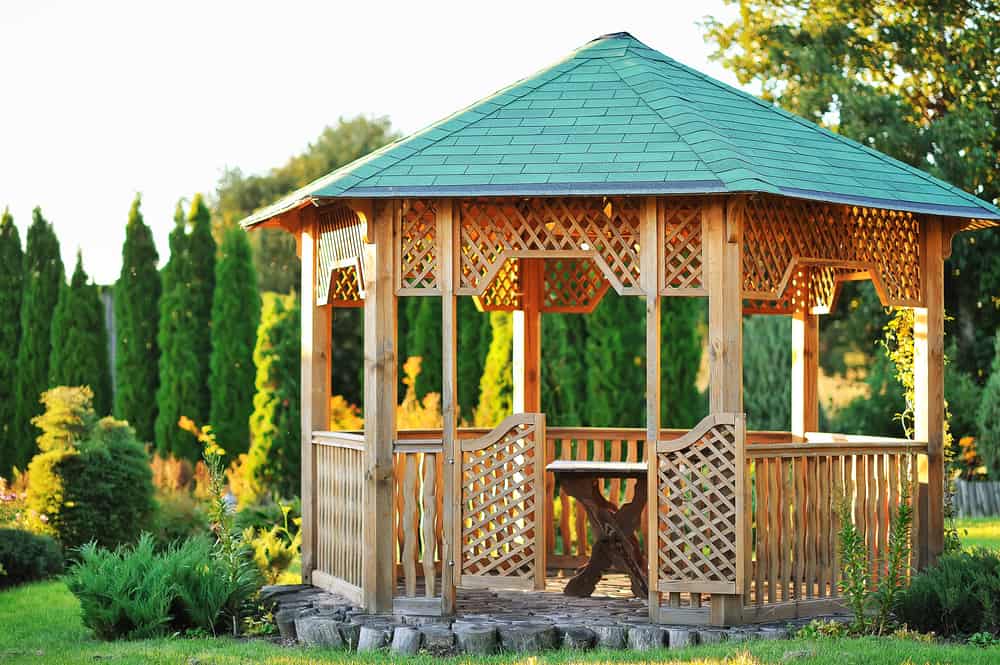 wooden gazebo green tile roof wood table