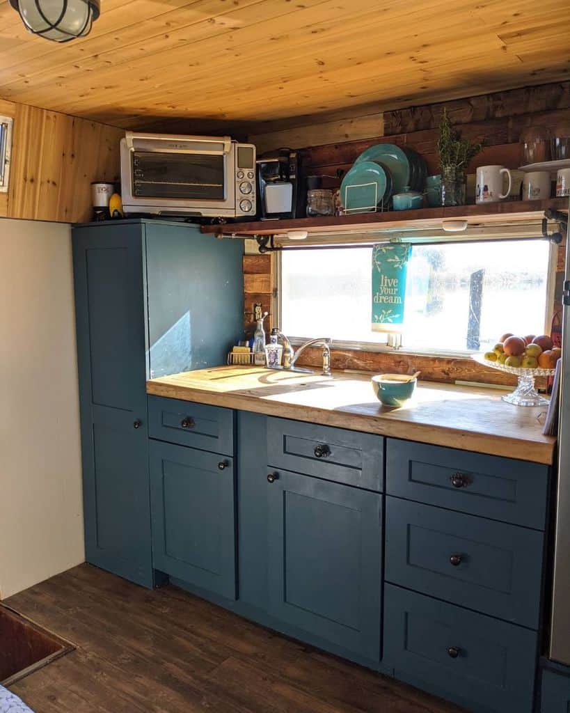 wooden kitchenette blue cabinets