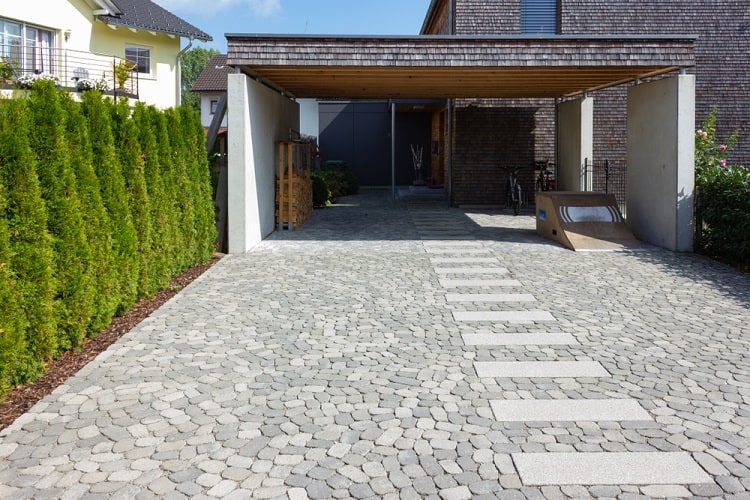 residential carport gray pavers driveway