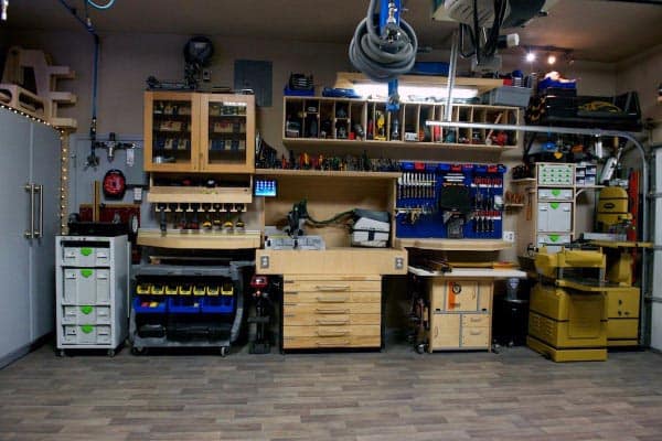 well organized garage workshop saw tools cabinets