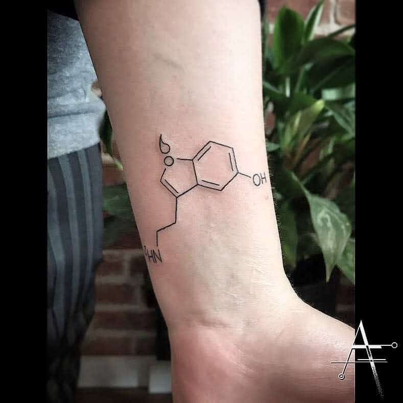 Tattoo of serotonin molecule on a wrist