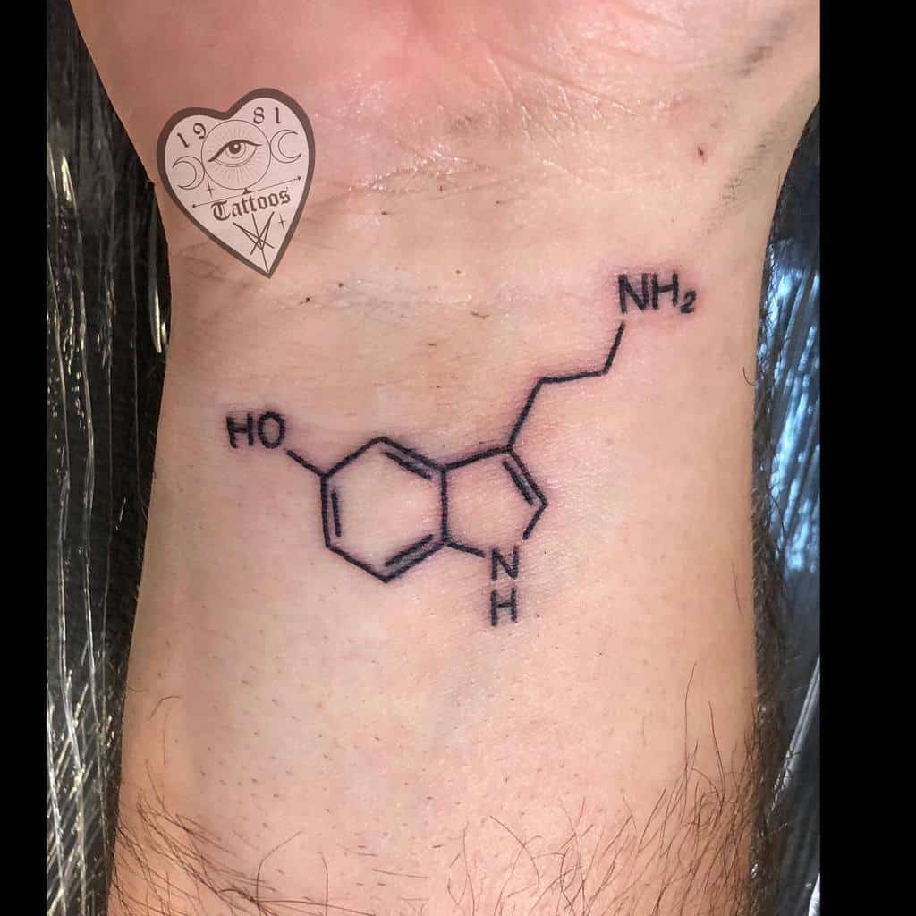 Tattoo of a serotonin molecule on a wrist