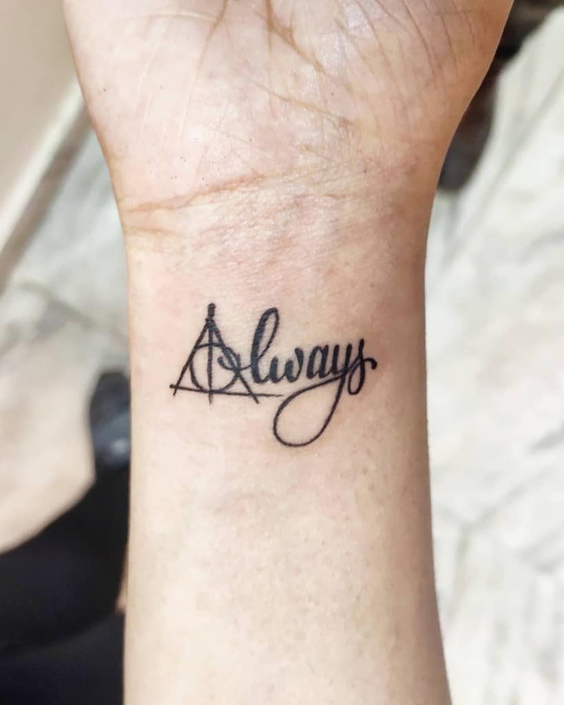 Elegant wrist tattoo with 'Always' in cursive and the Deathly Hallows symbol, inspired by Harry Potter's timeless love and loyalty