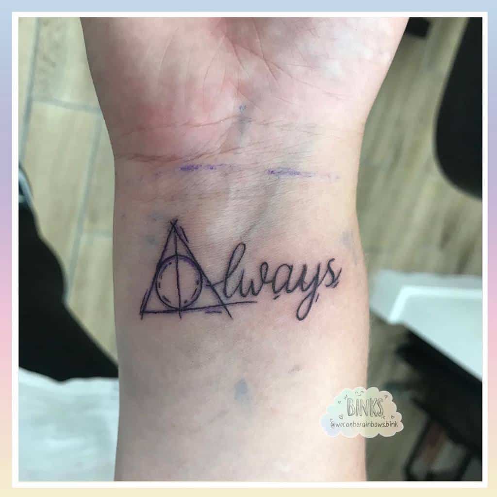 Harry Potter-inspired wrist tattoo featuring the Deathly Hallows symbol combined with the word 'always' in cursive, symbolizing eternal loyalty and magic