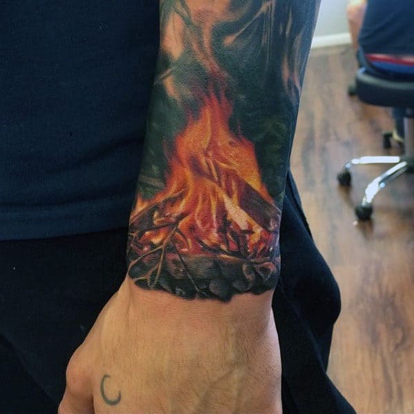 Wrist Flame Camp Fire Tattoo On Man