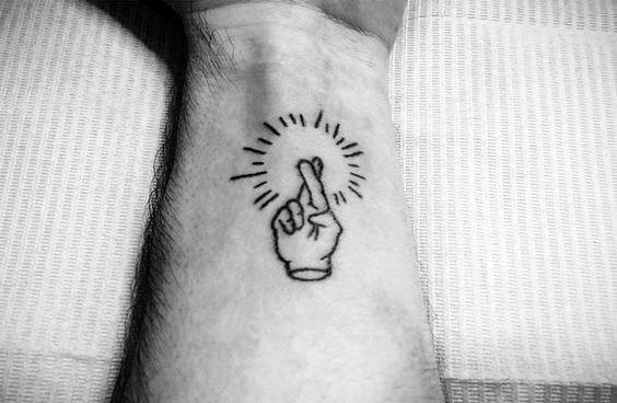 Wrist Glowing Fingers Crossed Mens Tattoo Ideas