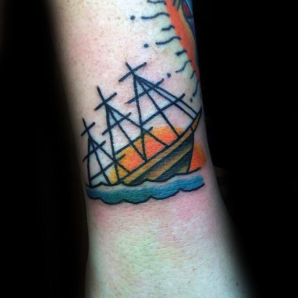 Traditional-style tattoo of a sinking ship against a bold orange and yellow sunset, with stylized waves and clean black outlines.