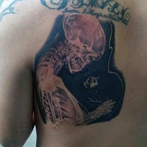 X Ray Skeleton Holding Rose Flower Mens Bone Tattoo On Back