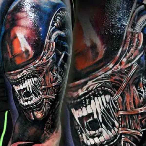 Vivid and aggressive Xenomorph tattoo with intense red, blue, and black tones, showing the alien screaming with sharp biomechanical detail.